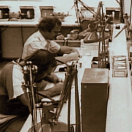 Manufacturing employees working on hearing aids